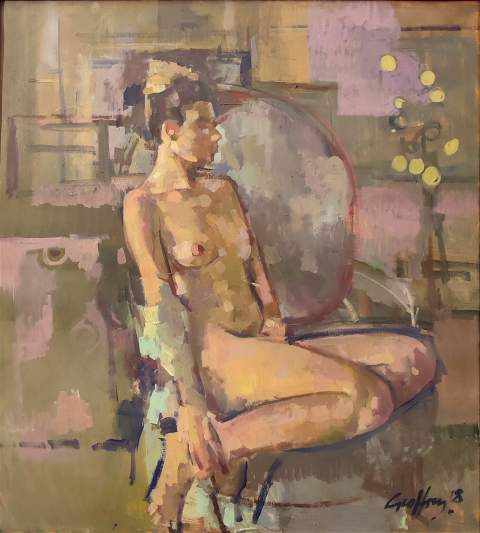 Portrait of a seated nude girl